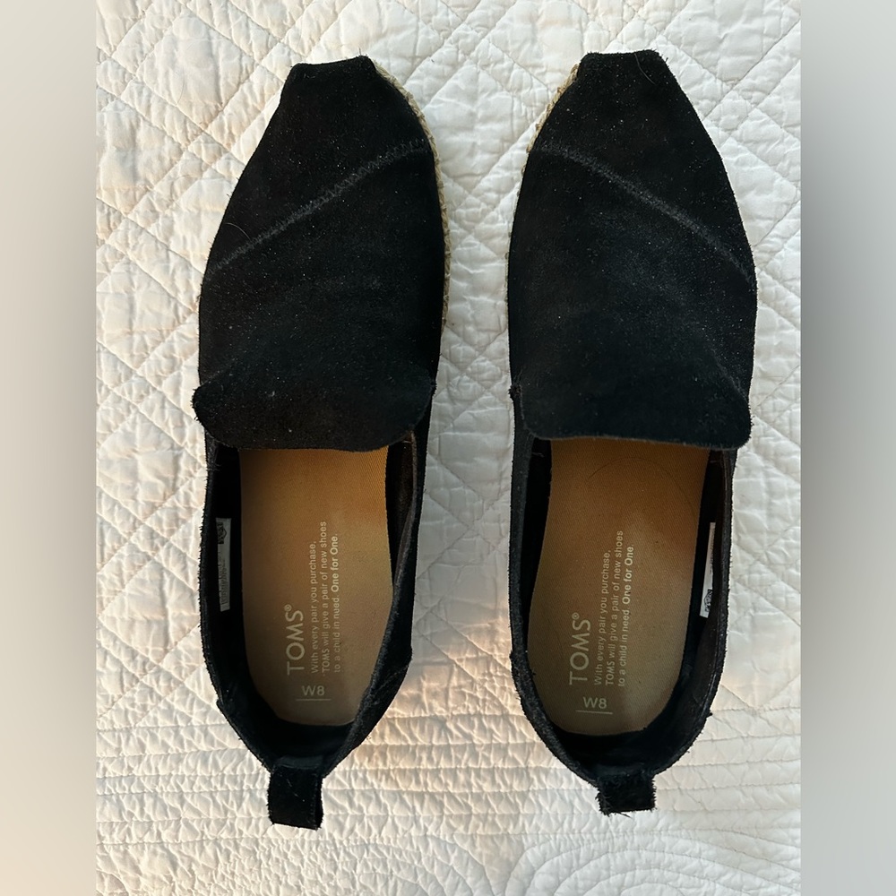 Tom’s black suede flats